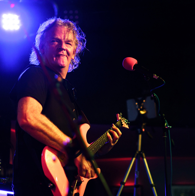 Mark James Ross sings lead and plays guitar with The Climate Stripes