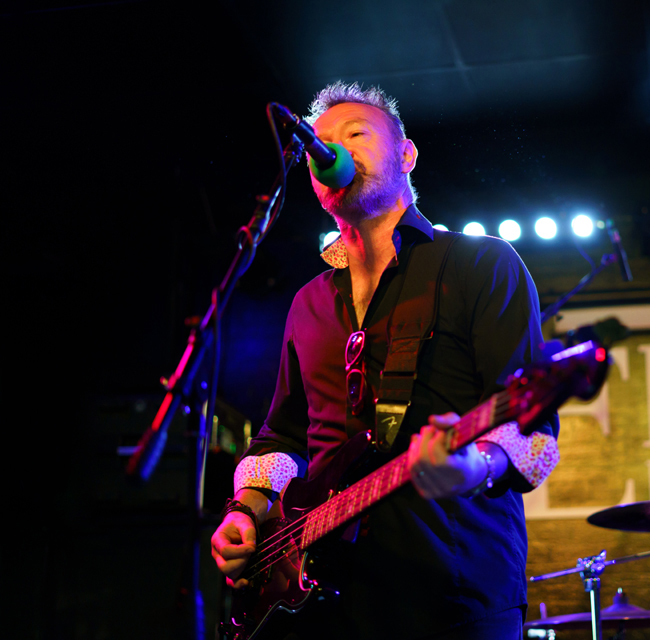 Pete Moran plays bass and sings backing vocals with The Climate Stripes